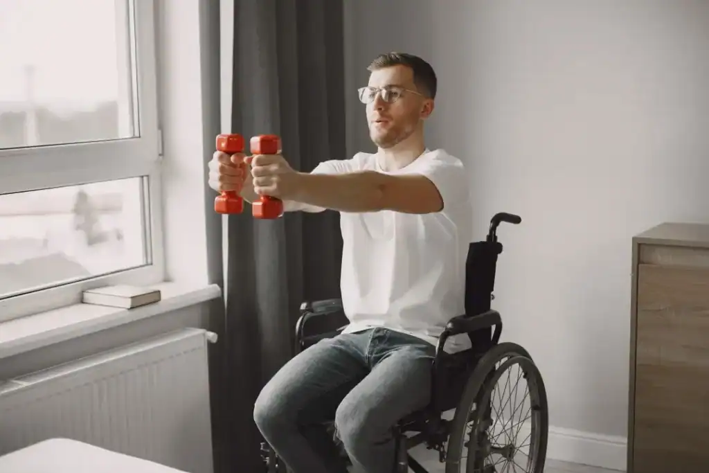 Image of man doing exercise in his wheelchair to aid weight loss Burgess Hill