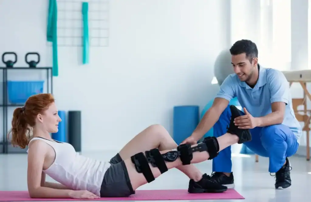 Woman having treatment to help muscle recovery Burgess Hill after an injury