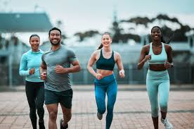 Sculpting Sleek Arms: The Essential Role of Cardio in Toning Without Bulking Up 3 image of people running to incorporate cardio Burgess Hill exercise into their life to help tone arms and body.