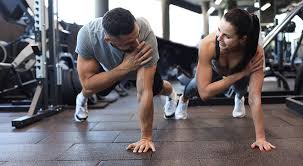 Image of man and woman doing Cardio Burgess Hill to tone their arms. 
